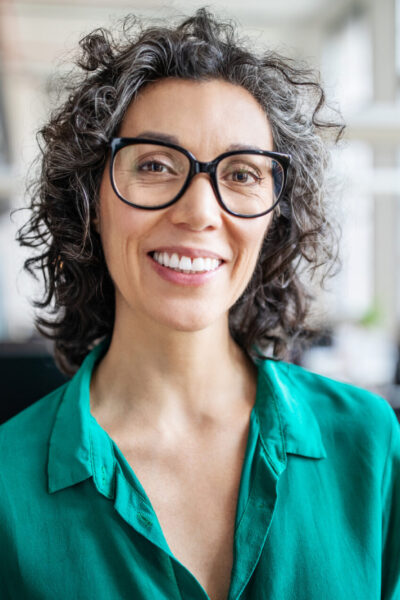 Close-up of a smiling mid adult businesswoman Nurse starting her new job at Alternative Care Center in Kalamazoo